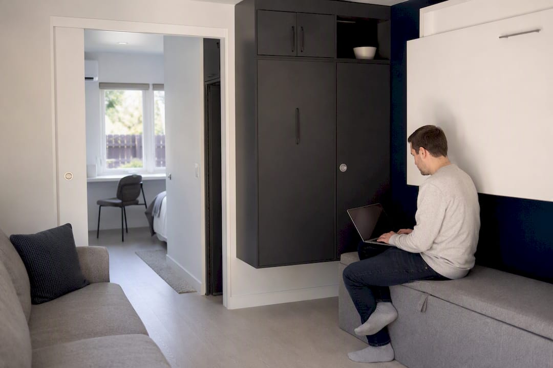 Optimized small ADU interior with pocket door and loft storage